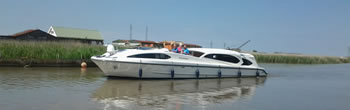 Cruising past St Olaves on the Norfolk Broads